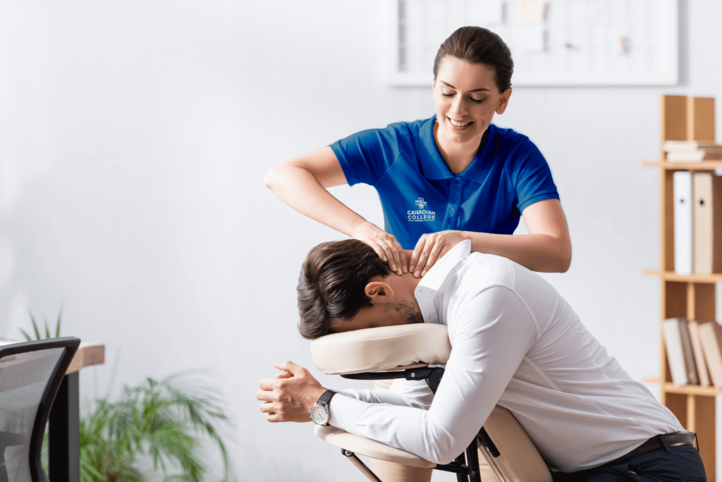 A student massaging a client's neck at CCHST