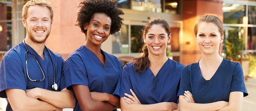 Group of healthcare professionals wearing scrubs. Learn more about the Healthcare programs at CCHST.